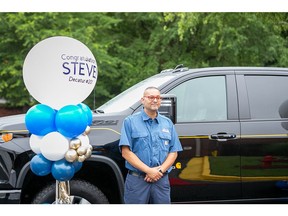 Cintas Service Sales Representative (SSR) Steve Rosa stands next to his brand-new truck that he won in April through a Cintas-Carhartt customer awareness campaign. The vehicle was delivered to Rosa's Decatur, Ga., Cintas location on Thursday morning.