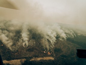 A wildfire raging west of Chibougamau, in Northern Quebec, is shown in a June 4, 2023, handout photo. Wildfires across Canada are forcing some forestry companies to pause operations, particularly in Quebec.
