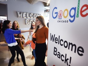 Employees are welcomed back to work with breakfast in the cafeteria at the Chicago Google offices on April 5, 2022.
