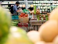 A person shops for groceries in a store. Canada's major grocers have argued they are not profiting over food inflation.