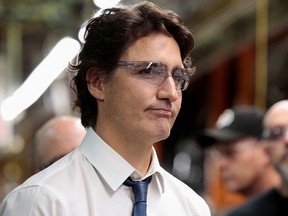 Prime Minister Justin Trudeau wears safety glasses while touring the Stellantis Windsor Assembly Plant in January this year. Pressure is on Canadian governments to reach a deal that will secure a battery factory for Windsor.