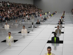 Models wear creations for the Dior Menswear Spring/Summer 2024 fashion collection presented in Paris, Friday, June 23, 2023.