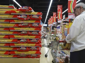FILE - Customers look at packages of pasta on sale in a supermarket in Milan, northern Italy, on June 8, 2023. Italians can celebrate lower pasta prices but must face higher prices across the board for fruit and vegetables. Italy's industry ministry reported last week that prices of pasta had fallen by an average of 0.3% in May compared with a month earlier, saying that a monitoring system it set up had the intended effect of reducing prices.