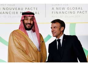 Emmanuel Macron and Saudi Crown Prince Mohammed attend the New Global Financial Pact Summit in Paris on June 22. Photographer: Ludovic Marin/Getty Images