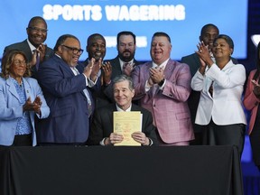 Gov. Roy Cooper signs House Bill 347: Sports Wagering/Horse Racing Wagering into law on Wednesday, June 14, 2023 at Spectrum Center in Charlotte, N.C. Regulated sports betting and horse racing should begin across North Carolina in the first half of next year after Gov. Roy Cooper signed into law Wednesday legislation that greatly expands gambling opportunities in the ninth-largest state.