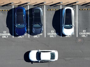 Tesla Inc. cars recharge at a charger station in Corte Madera, California.