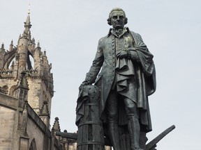 Statue of Scottish economist, philosopher and writer Adam Smith on the Royal Mile in Edinburgh, U.K.
