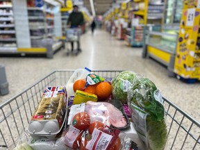 Food items loaded into a shopping trolley inside a Tesco supermarket store in east London.