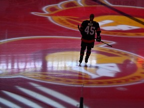 FILE - Ottawa Senators left wing Parker Kelly skates as projections of the team's logo spin on the ice before the team's NHL hockey game against the Boston Bruins on Tuesday, Oct. 18, 2022, in Ottawa, Ontario. A group led by Canadian businessman Michael Andlauer has reached an agreement to buy the NHL's Ottawa Senators. The team announced Tuesday, June 13, 2023, that Andlauer and his group will purchase 90% of the club from the Melnyk family.