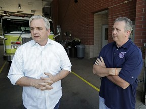 FILE - Timothy Stromsnes, left, then-president of the Reedy Creek Professional Firefighters, Local 2117, and then-union vice president Sean Pierce air concerns about the firefighting staff at Walt Disney World on May 28, 2019, in Lake Buena Vista, Fla. The local has been warning for years that they are understaffed and that poses a safety risk as the central Florida theme park resort grows bigger.