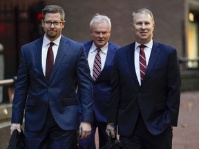 FILE - Former Ohio Republican Party Chairman Matt Borges, right, walks toward Potter Stewart U.S. Courthouse with his attorneys Todd Long, left, and Karl Schneider, center, before jury selection in his federal trial, Jan. 20, 2023, in Cincinnati, Ohio. Borges has been sentenced, Friday, June 30, 2023, to five years in prison and three years of probation for his part in the largest corruption scandal in Ohio history. AP Photo/Joshua A. Bickel, File)