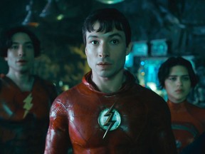 This image released by Warner Bros. Pictures shows Ezra Miller, from left, Ezra Miller and Sasha Calle in a scene from "The Flash." (Warner Bros. Pictures via AP)