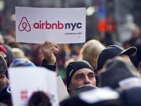 FILE -- Supporters of Airbnb hold a rally outside City Hall in New York, Jan. 20, 2015. Airbnb sued New York City, Thursday, June 1, 2023, over an ordinance that the company says imposes arbitrary restrictions that would greatly reduce the local supply of short-term rentals.