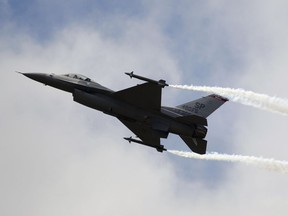 FILE - A Lockheed Martin F-16 Jet fighter performs its demonstration flight, June 22, 2011, at the 49th Paris Air Show at Le Bourget airport, east of Paris. People living in and around Washington D.C. experienced a rare, if startling, sound: A sonic boom. The U.S. military had dispatched a fighter jet on Sunday, June 4, 2023, to intercept an unresponsive business plane that was flying over restricted airspace. The Air Force gave the F-16 permission to fly faster than the speed of sound to catch up with it.