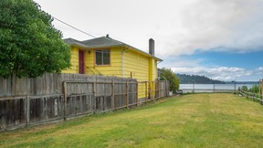 The old yellow house owned by Jim Pattison is up for sale for a dollar if someone will arrange to move it.