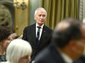 Phillip Crawley, publisher and CEO of the Globe and Mail, makes his way to be invested as a member of the Order of Canada by former governor general Michaelle Jean on behalf of Gov. Gen. Mary Simon during a ceremony at Rideau Hall in Ottawa, on Thursday, Nov. 17, 2022. Crawley is retiring, to be replaced by Andrew Saunders.