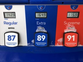 Gas prices are displayed at an Esso station in Oakville, Ont., Saturday, Feb.25, 2023. Canadians heading out on the road for the July 1 long weekend will find filling up at the pumps to be much less shock-inducing than last year at this time.