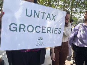 Proponents of a tax removal on groceries hold a rally April 11, 2023, outside the Statehouse in Montgomery, Ala. Alabama lawmakers on Thursday, June 1, 2023 approved legislation that would remove half of the state's 4% sales tax on groceries.