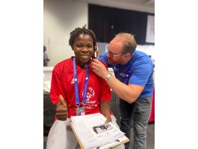 Starkey Cares volunteer Kim Fredrik Haug (right) is shown with Special Olympics athlete Safiatou Konare from Mail (left).