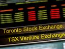 A sign board displaying the Toronto Stock Exchange (TSX) stock information in Toronto.