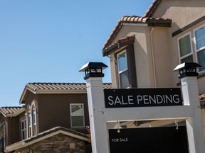 A "Sale Pending" sign outside a house