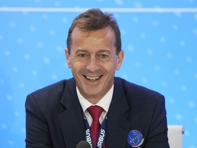 Airbus CEO Guillaume Faury smiles at a news conference during the Paris Air Show in Le Bourget, north of Paris, France, Monday, June 19, 2023.