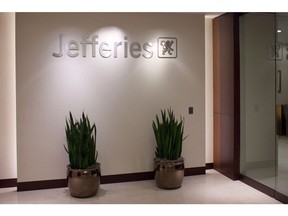 The logo of Jefferies Group Inc. is seen in the entryway of their offices in Houston, Texas, U.S., on Wednesday, Nov. 10, 2010. Jefferies Group Inc., the investment bank that's been expanding its advisory and fixed-income businesses, said fiscal second-quarter profit fell 3.8 percent as sales and trading revenue decreased and compensation costs rose.