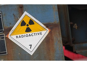 A radioactive warning sign sits on the side of a railway goods wagon parked in the sidings of Sellafield atomic fuel reprocessing site, operated by Sellafield Ltd., in Seascale, U.K., on Monday, Dec. 19, 2016. Sellafield, the 70-year-old home to Europe's largest nuclear site with 10,000 employees and its own rail service and police and fire departments looks its age and will eventually cost at least 90 billion to properly clean up, says Paul Dorfman, honorary senior researcher at the Energy Institute at University College London. Photographer: Matthew Lloyd/Bloomberg
