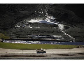 A pickup truck drives past a coal mound at the NRG Energy Inc. WA Parish generating station in Thompsons, Texas, U.S., on Thursday, Feb. 16, 2017. The plant is home to the Petra Nova Carbon Capture Project, a joint venture between NRG Energy and JX Nippon Oil & Gas Exploration Corp., which reportedly captures and repurposes more than 90% of its own Co2 emissions.