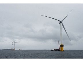 Barges position offshore floating wind turbines during assembly in the Hywind pilot park, operated by Statoil ASA, in Stord, Norway, on Friday, June 23, 2017. The world's first offshore floating wind farm will be moved to its final destination outside Peterhead, Scotland, later this summer to provide clean energy to 20,000 British households.