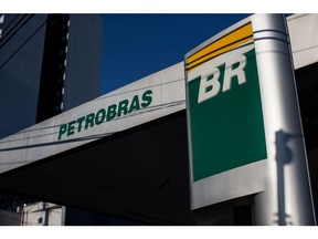 Signage is displayed at a Petroleos Brasileiros SA (Petrobras) gas station in Sao Paulo, Brazil, on Friday, June 1, 2018. Pedro Parente resigned as chief executive officer of Brazil's state-controlled oil company under pressure from President Michael Temer in the wake of a nationwide strike against high fuel prices. Photographer: Victor Moriyama/Bloomberg