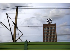 The Volkswagen AG logo sits on an office building at the automaker's headquarter factory in Wolfsburg, Germany, on Tuesday, Aug. 25, 2020. German companies have turned slightly more optimistic that the economy will continue on its long road to recovery, after the pandemic eroded spending and investment in the first half of the year.