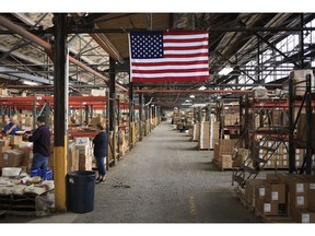 A U.S. flag is displayed in a warehouse at the Fiesta Tableware Co. factory in Newell, West Virginia, U.S., on Thursday, July 22, 2021. Photographer: Luke Sharrett/Bloomberg