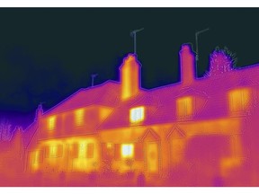 A row of traditional English cottages, taken with a heat-sensing camera showing higher amounts of heat emitted in the brighter parts, in Shalford, U.K., on Monday, Dec. 6, 2021. U.K. households, already bracing for their energy bills to rise by "several hundred pounds," will see a further jump following the collapse of Bulb Energy Ltd. and other suppliers, the regulator said. Photographer: Jason Alden/Bloomberg