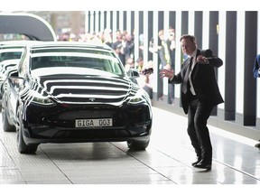 GRUENHEIDE, GERMANY - MARCH 22: Tesla CEO Elon Musk attends the official opening of the new Tesla electric car manufacturing plant on March 22, 2022 near Gruenheide, Germany. The new plant, officially called the Gigafactory Berlin-Brandenburg, is producing the Model Y as well as electric car batteries.