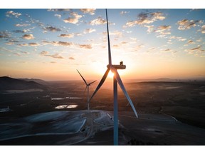 Wind turbines at the Martin de la Jara wind farm, operated by Iberdrola SA, during sunrise in the Martin de la Jara district of Sevilla, Spain, on Friday, April 21, 2023. In November, Spain's biggest utility Iberdrola said it would allocate €27 billion over the next three years to power grids, expanding and strengthening capacity as more renewable energy flows into the system and industries electrify.