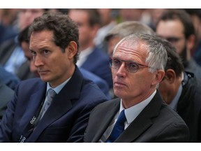 John Elkann, chairman of Stellantis NV, left, and Carlos Tavares, chief executive officer of Stellantis NV, during the inauguration of the Automotive Cells Company (ACC) gigafactory in Douvrin, France, on Tuesday, May 30, 2023. Leaders and companies in Europe's biggest markets are increasingly balking at the ambitious pace of the continent's green push as they confront the massive costs associated with economic transformation. Photographer: Nathan Laine/Bloomberg