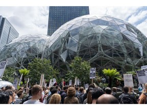 Amazon employees during a walkout outside the Amazon Spheres, part of the Amazon headquarters campus, in Seattle, Washington, US, on Wednesday, May 31, 2023. The Amazon.com Inc. employees are demanding more flexibility with remote work and more attention on Amazon's climate impact.