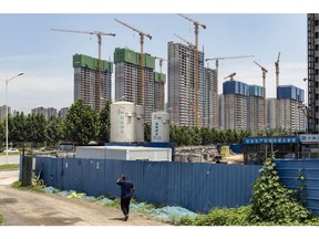 Residential buildings under construction in Zhengzhou, Henan province, China, on Wednesday, June 7, 2023. China is working on a new basket of measures to support the property market after existing policies failed to sustain a rebound in the ailing sector, according to people familiar with the matter. Photographer: Qilai Shen/Bloomberg
