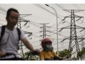 High tension power lines in Shanghai, China, on Friday, June 23, 2023. Extreme weather is already promising a fresh test of the electricity grid just months after heat waves and drought throttled hydropower and triggered widespread power shortages. Photographer: Qilai Shen/Bloomberg