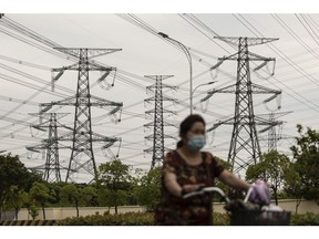 High tension power lines in Shanghai, China, on Friday, June 23, 2023. Extreme weather is already promising a fresh test of the electricity grid just months after heat waves and drought throttled hydropower and triggered widespread power shortages. Photographer: Qilai Shen/Bloomberg