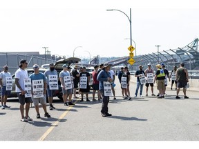A picket line at the Neptune Terminal at the Port of Vancouver during a dockworkers strike in Vancouver, British Columbia, Canada, on Wednesday, July 5, 2023. The International Longshore and Warehouse Union representing more than 7,000 dockworkers went on strike Saturday morning after federal-mediated negotiations failed.
