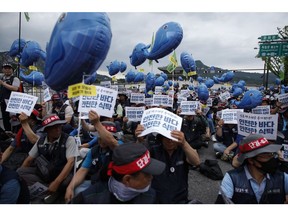 A protest against Japan's plan to release treated wastewater from the Fukushima nuclear disaster site into the Pacific Ocean in Seoul, on July 8. Photographer: Woohae Cho/Bloomberg