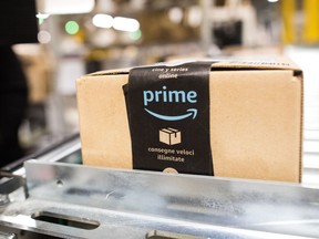 A package sits on a conveyor belt at an Amazon.com Inc. fulfilment centre in the U.K. Amazon's stock has fallen in the past four years during its Prime Day event.