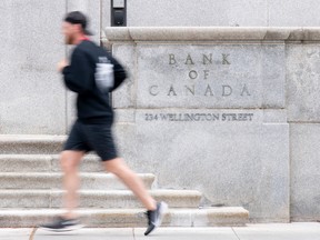 A runner passes the Bank of Canada in Ottawa.
