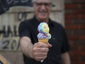 Peter O'Brien holds a cone of Moon Mist ice cream, the most popular flavour of ice cream in Atlantic Canada, in Halifax on Tuesday, July 4, 2023. O'Brien's grandfather ran a creamery where O'Brien says his grandfather invented the flavour known today as Moon Mist before the flavour combination was shopped around to different dairies.