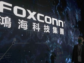 FILE - The Foxconn logo is seen during the Hon Hai Tech Day at the Nangang Exhibition Center in Taipei, Taiwan, on Oct. 18, 2022. Taiwan-based electronics giant Foxconn is backing out of a $19.5 billion semiconductor joint venture with Indian mining conglomerate Vedanta Ltd. India's government leaders say they aren't too worried about the impact.