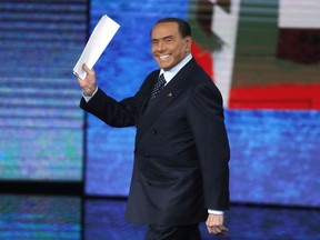 FILE - Former Italian premier Silvio Berlusconi waves as he arrives for the Italian State RAI TV program "Che Tempo che Fa", in Milan, Italy, on Nov. 26, 2017. Berlusconi, the boastful billionaire media mogul who was Italy's longest-serving premier despite scandals over his sex-fueled parties and allegations of corruption, died, according to Italian media. He was 86.