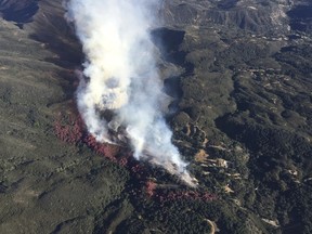 FILE - This photo provided by Los Padres Forest Aviation and KEYT-TV shows a wildfire burning in Los Padres National Forest, north of Santa Barbara, on Wednesday, June 15, 2016, in Goleta, Calif. Southern California Edison and two other companies have paid $22 million to settle U.S. government claims that they caused a 2016 wildfire that burned thousands of acres of national forest, Friday, July 7, 2023
