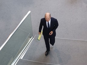 German Chancellor Olaf Scholz arrives during a meeting of the German federal parliament, Bundestag, at the Reichstag building in Berlin, Germany, Wednesday, July 5, 2023.